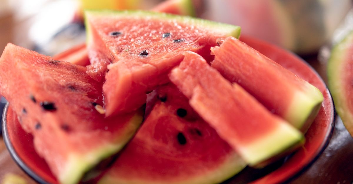 Close-up of fresh, sliced watermelons on a plate perfect for summer refreshment.