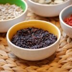 Hokkaido University study of 56 japonica rice finds black and green rice contain FAHMFAs and LNAPEs beneficial fats and digested slower than white rice for metabolic health.
